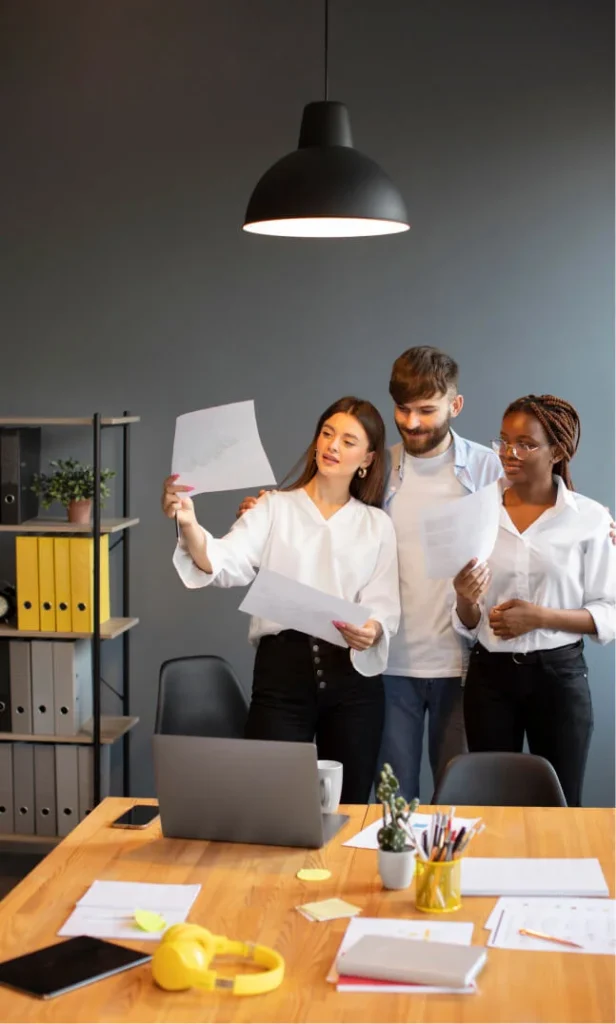 Responsive wobble animation image of three teammates finalizing a digital marketing project for a clients.